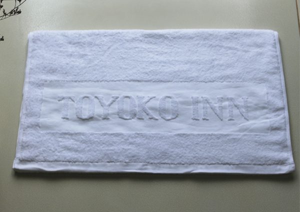 khăn thêu logo toyoko inn
